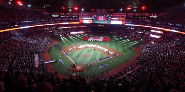 3D0TW1M Toronto, Canada. 24th Oct, 2025. The Canadian flag is displayed during pre-game ceremonies before the start of game one of the MLB World Series between the Los Angeles Dodgers and the Toronto Blue Jays at Rogers Centre in Toronto, Canada, on Friday, October 24, 2025. Photo by Aaron Josefczyk/UPI Credit: UPI/Alamy Live News